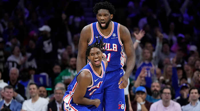 Philadelphia 76ers’ Tyrese Maxey and Joel Embiid celebrate after scoring vs. the Boston Celtics.